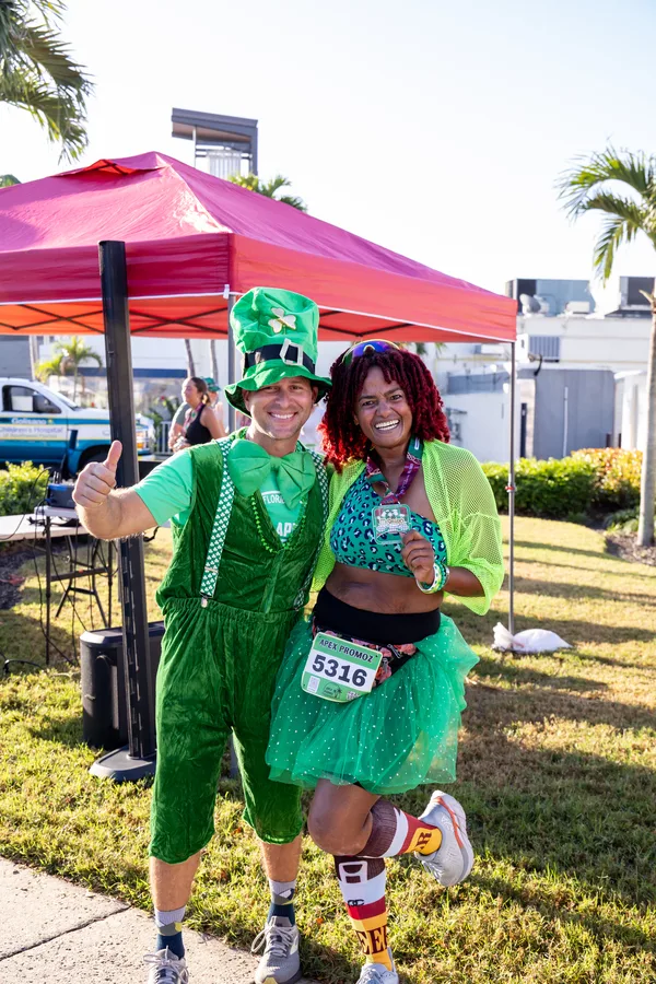 Image of attendees in St Patty's day attire at an Apex Promoz & the Bell Tower Shops event