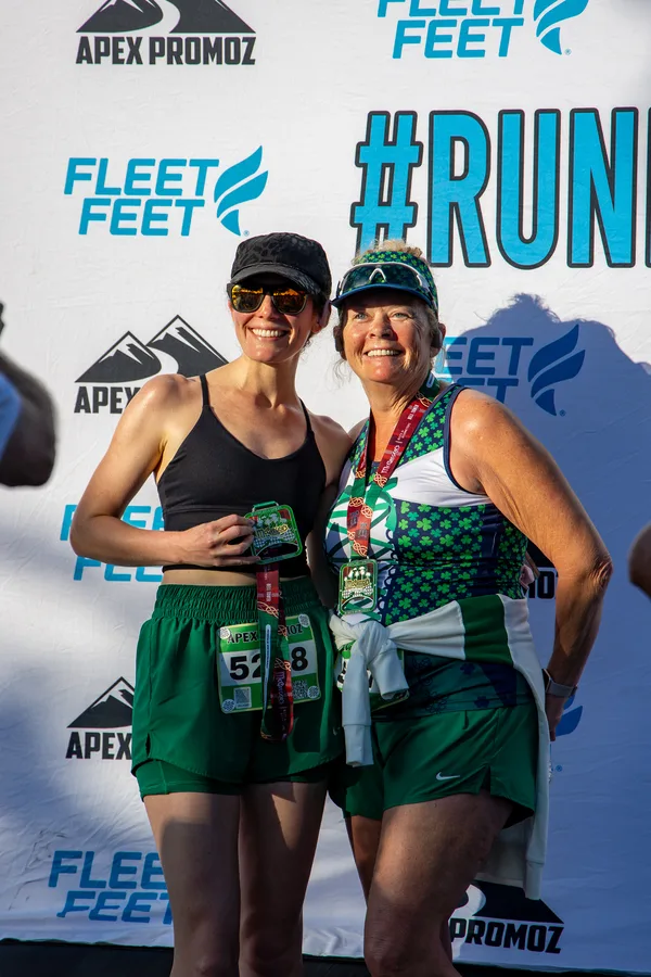 Image of attendees in St Patty's day attire at an Apex Promoz & the Bell Tower Shops event